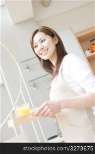 Japanese woman Carrying a orange juice