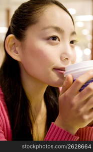 Japanese woman drinking a coffee