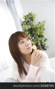 Japanese woman eating a snack