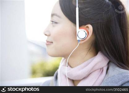 Japanese woman listening to the music