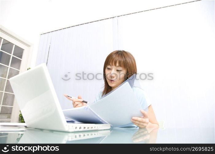 Japanese woman operating a PC