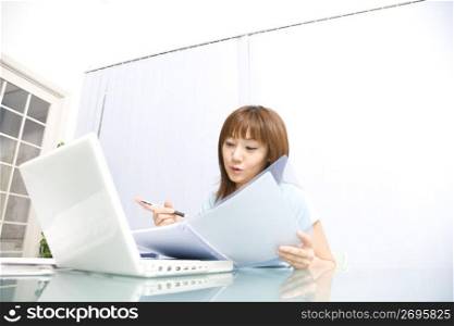 Japanese woman operating a PC
