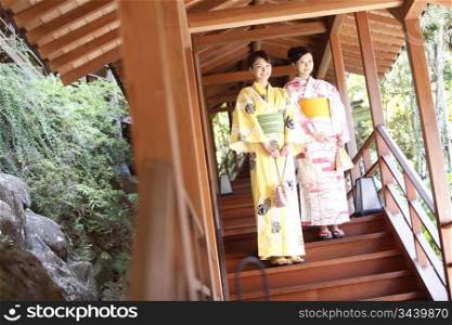 Japanese woman putting on a yukata