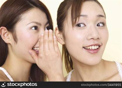 Japanese woman talking secretively