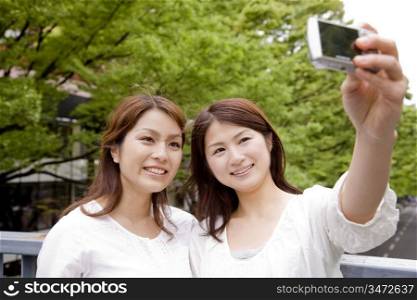 Japanese women taking a photo