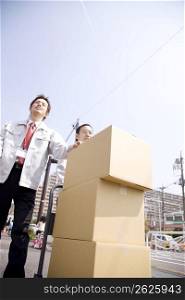 Japanese workers carrying corrugated cardboards