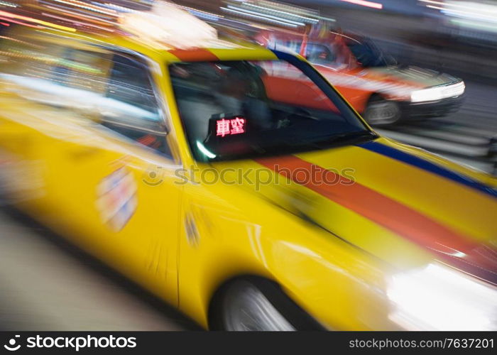 Japanese yellow taxi blur. Japan