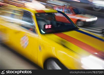 Japanese yellow taxi blur. Japan