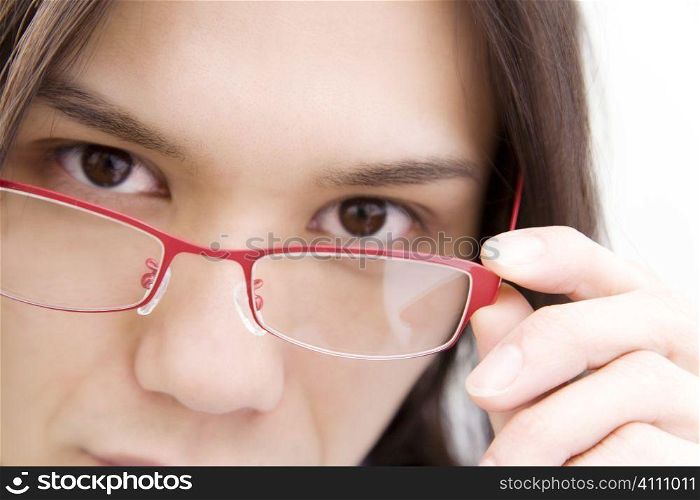 Japanese young office worker putting on glasses