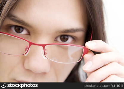 Japanese young office worker putting on glasses