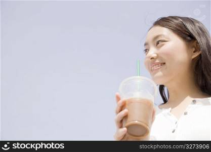 Japanese young woman drinking coffee