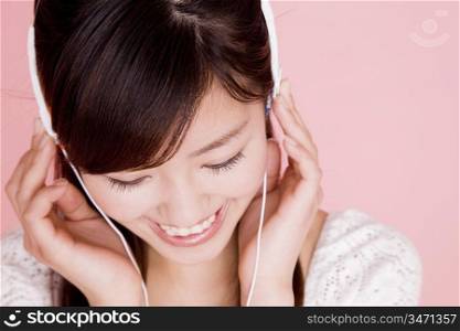 Japanese young woman listening to the music