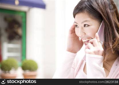 Japanese young woman talking with cellphone