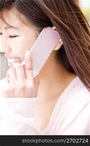 Japanese young woman talking with cellphone
