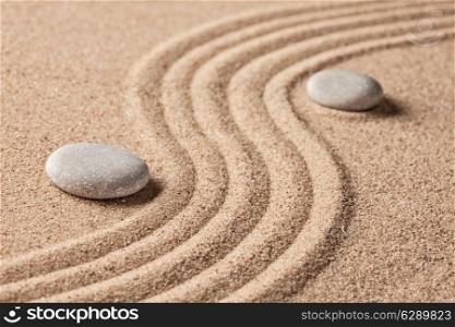 Japanese Zen stone garden - relaxation, meditation, simplicity and balance concept - pebbles and raked sand tranquil calm scene