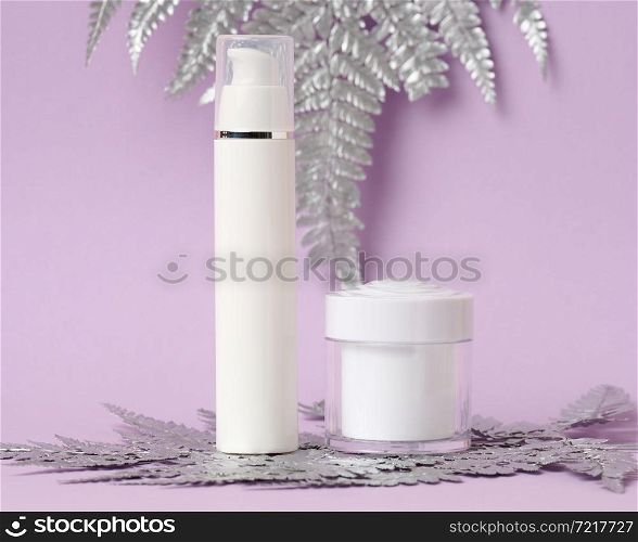jar and empty white plastic tubes for cosmetics on a purple background. Packaging for cream, gel, serum, advertising and product promotion, mock up