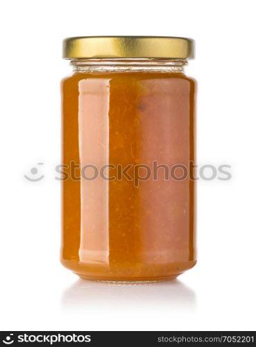 Jar of Apricot or peach jam isolated on white background with clipping path