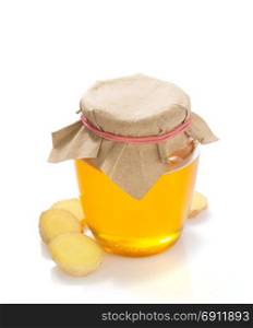 jar of honey and ginger isolated on white background
