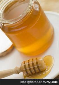 Jar of honey and spoon