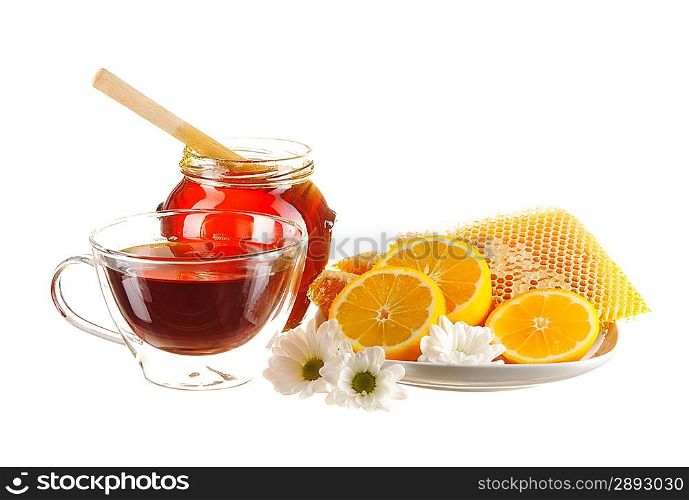 Jar of honey and tea cup isolated over white
