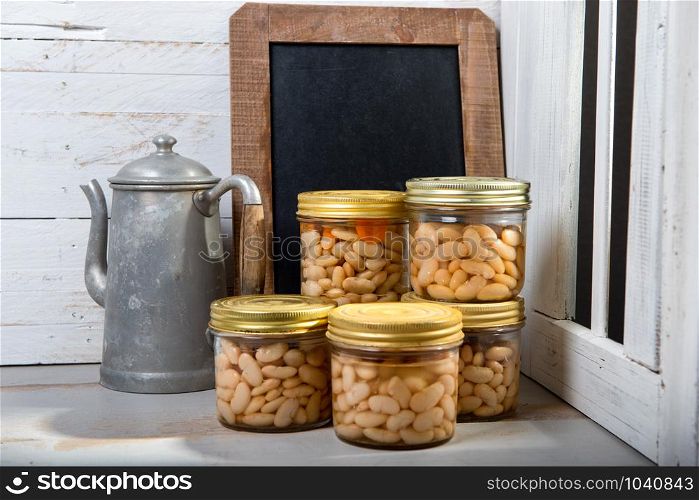 jars of delicious white beans near the window