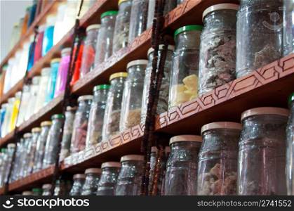 Jars of herbs and powders in a moroccan spice shop in the marrakech medina, Morocco