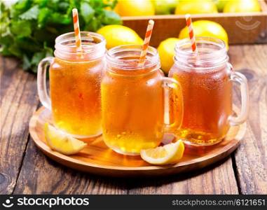 jars of lemon ice tea with striped straw