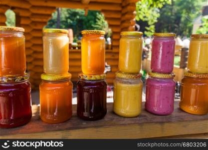 jars with honey, Honey in jar with honey dipper