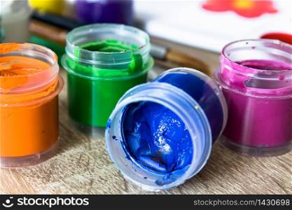 Jars with multi-colored gouache. Set for drawing, creativity and hobbies. Close-up.. Jars with multi-colored gouache. Set for drawing, creativity and hobbies.