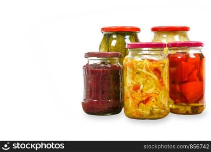 Jars with variety of homemade pickled vegetables isolated on a white background with copy space place .