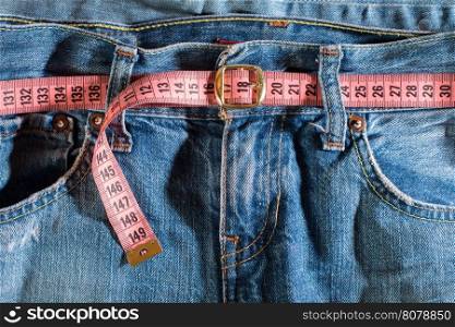 Jeans and centimeter. Belt with buckle