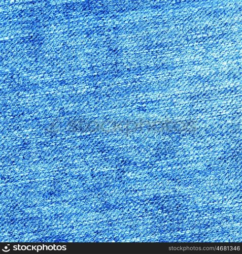 Jeans fabric. Texture blue jeans cloth used as background.