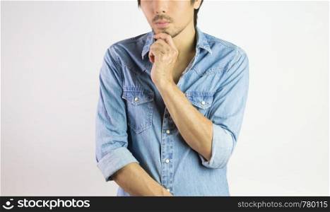 Jeans Shirt or Denim Shirt Man Fashion Front View with Man Touch Chin Pose. Jeans shirt or denim shirt fashion for men on grey background