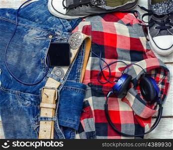 Jeans,shirt, sneakers and phone with headphones for teenagers