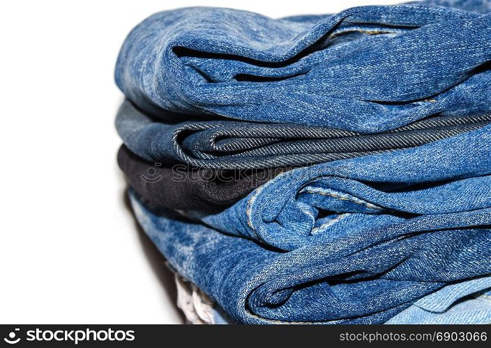 jeans stacked isolated on white background.