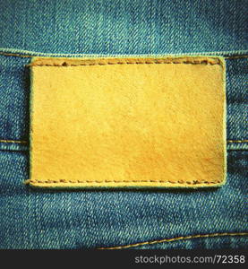 Jeans with blank leather label. Retro style filtred image