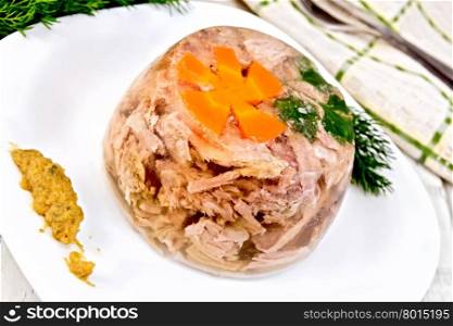 Jellied pork and beef with carrots and parsley on a plate with mustard and dill, kitchen towel on a background of wooden boards