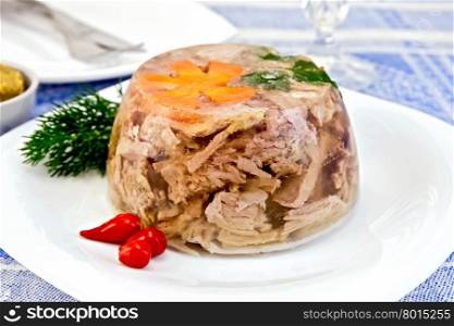 Jellied pork and beef with carrots and parsley on a plate with spicy red pertsemey and dill, mustard on a background of a linen tablecloth