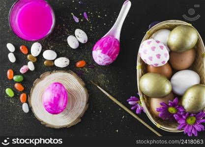jelly beans near paint eggs