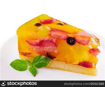 Jelly cake with fruit on white plate
