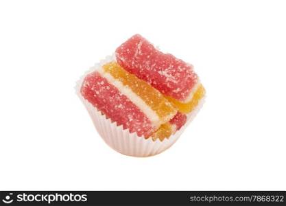 jelly candies in white cup cake case isolated on white