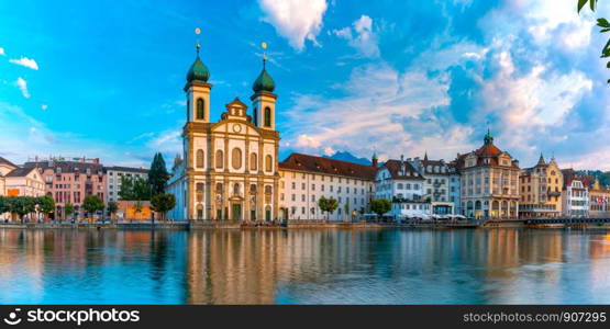 Jesuit Church and fairy tale houses along the river Reuss at sunset in Old Town of Lucerne, Switzerland. Lucerne at sunset, Switzerland
