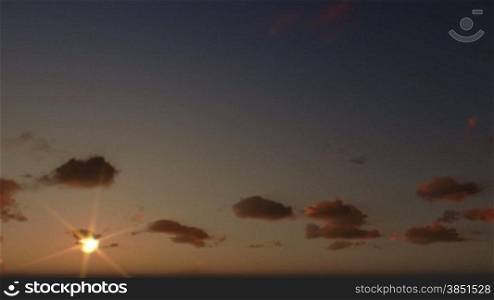 Jesus on Cross, close up, timelapse clouds at sunset, panning