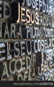 Jesus word carving on wall