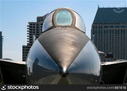 Jet fighter tip in front of skyscrapers in America