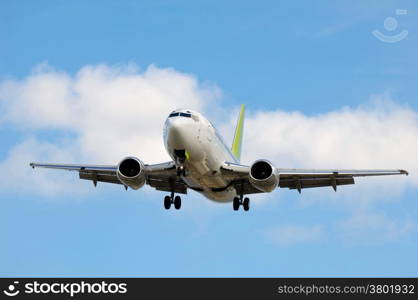 Jet plane is going to land in an airport.