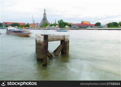Jetty terminal. Passenger ships sailing in the river. And back to Wat Arun.