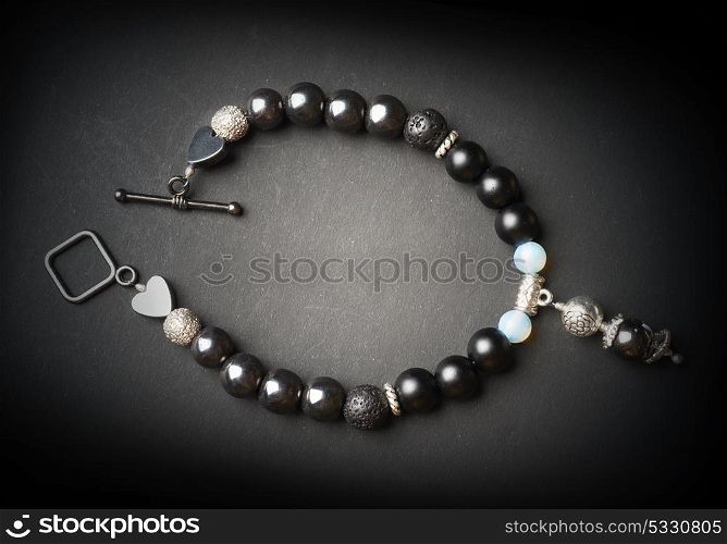 jewel handmade bracelet with semipreciouse stones at black background