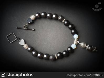 jewel handmade bracelet with semipreciouse stones at black background