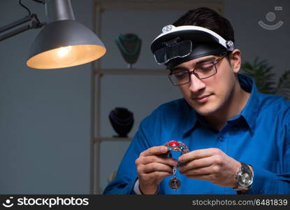 Jeweler working in his workshop late at night